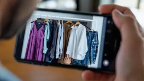 Realistic photo smartphone person holding clothing outfits mirror virtual fashion selection